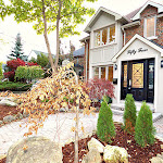 New renovation: Front of house showing stone bordered landscaping