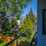 View from master bedroom deck with glass railings