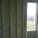 Foam insulation applied in between wall studs;
outside wall with a window shown