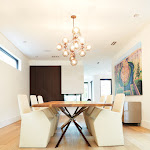 Dining room with modern chandelier and white oak flooring