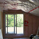 Before: Patio Door installed showing ceiling and wall insulation with vapour barrier