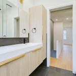 Modern bathroom with floating wood vanity