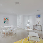 Downstairs living space with surround system and polished concrete flooring