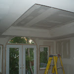 Upper floor-master bedroom with view toward back yard
This photo shows balcony door & windows and drywall installation