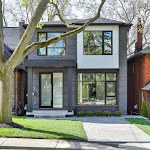 Front view of new modern house with concrete porch and stone interlocking