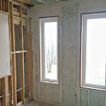 Foam insulation applied in between wall studs;
outside wall with windows shown