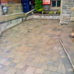 Sand added in between stone interlock to cement and seal drive way