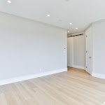 White oak engineered flooring in the main bedroom