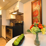 Kitchen renovation finished with White Cabinets and Stainless Steel Appliances