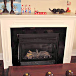 Fireplace with white painted wooden frame installed in the livingroom