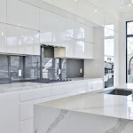 Modern kitchen with TCE stone quartz countertop and gray high glass backsplash