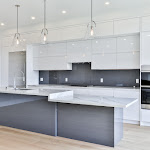 New modern kitchen with TCE stone quartz countertop and white cabinetry