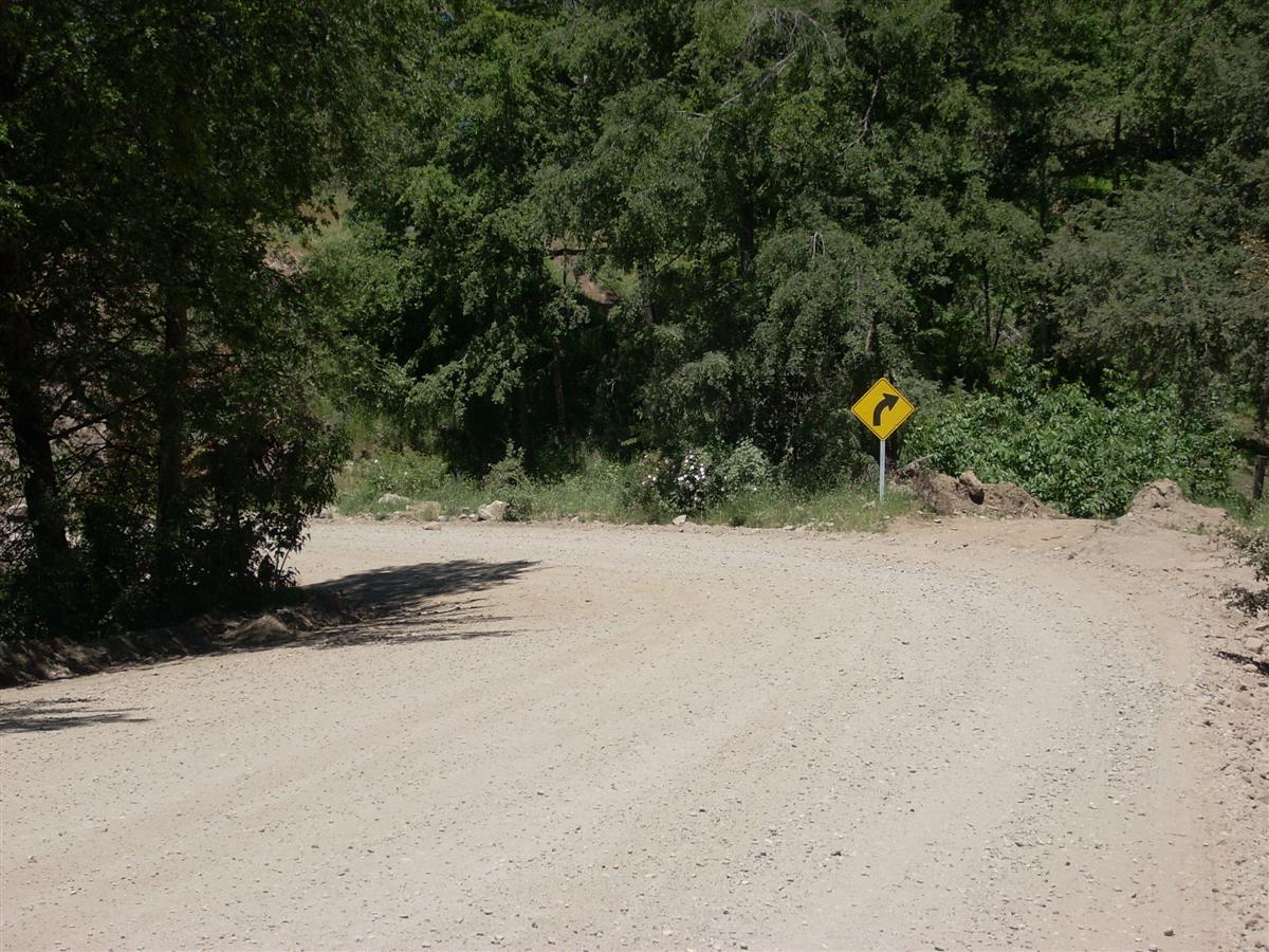 Note the sign pointing right, but the road going left