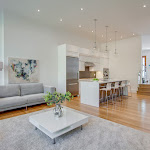 Living room with open concept Kitchen and white oak hardwood flooring