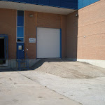 Gravel base added to create elevated entrance to completed industrial sized door