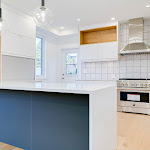 Modern waterfall countertop in newly renovated kitchen