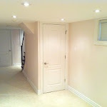 Basement renovation showing storage space underneath stairs