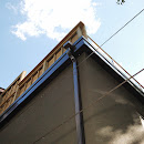 Deck installation looking up, showing new drains, soffit and fascia