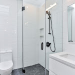 Family bathroom with glass-enclosed walk-in shower