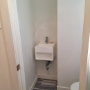 Powder room finished with marble floor tiles