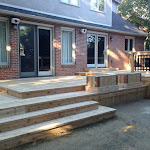 Wooden deck completed with stairs taking to the backyard