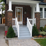 Porch renovation with wooden railing and steps painted grey and white