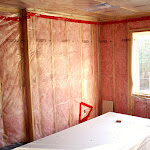 Upper floor-bedroom, view toward the street:
shown framing & installed insulation & vapour barrier