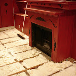 Foam insulation applied in between floor joist;
shown area around fireplace