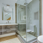 Family bathroom with single sink vanity and walk-in shower