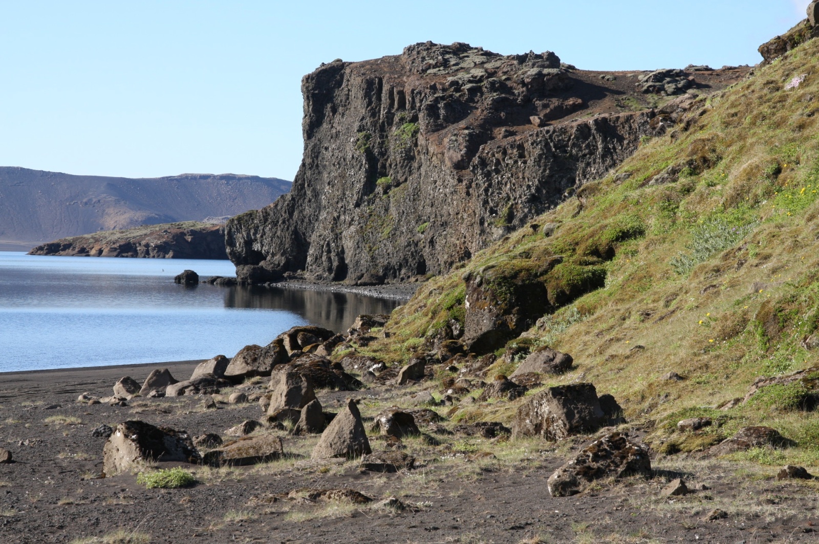 The rocky and semi-green shores of Kleifarvatn lake