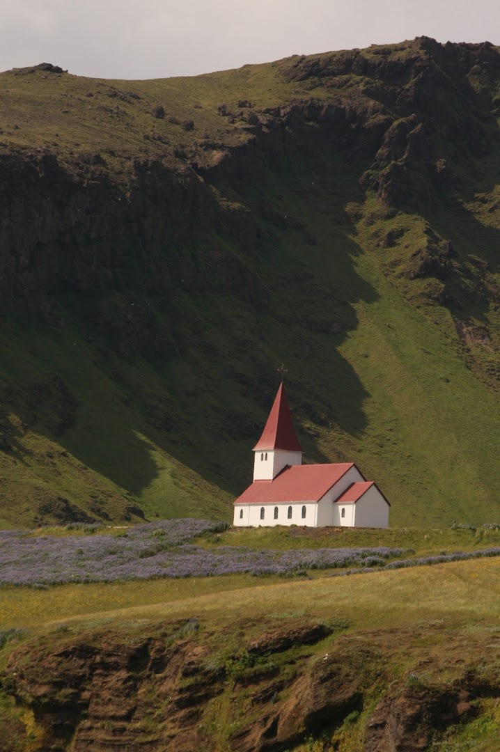 The church of Vik is above the town
