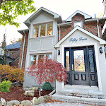 Front of house showing stone bordered landscaping