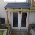 Awning in entrance connected with second floor deck