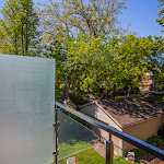 View from master bedroom deck with glass railings