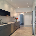 Kitchen renovated with modern cabinets,quartz countertop and porcelain tiles flooring