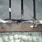 Floor joist-top view: foam insulation fills in all the gaps