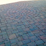 Circular pattern embedded in interlock paving