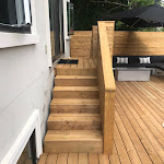 Stairs leading from the back door to the patio area