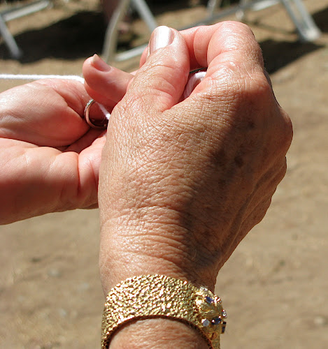 2008: Snapshot from son Greg's wedding with Mallee Sato (Julie's hands passing the ring on a string)