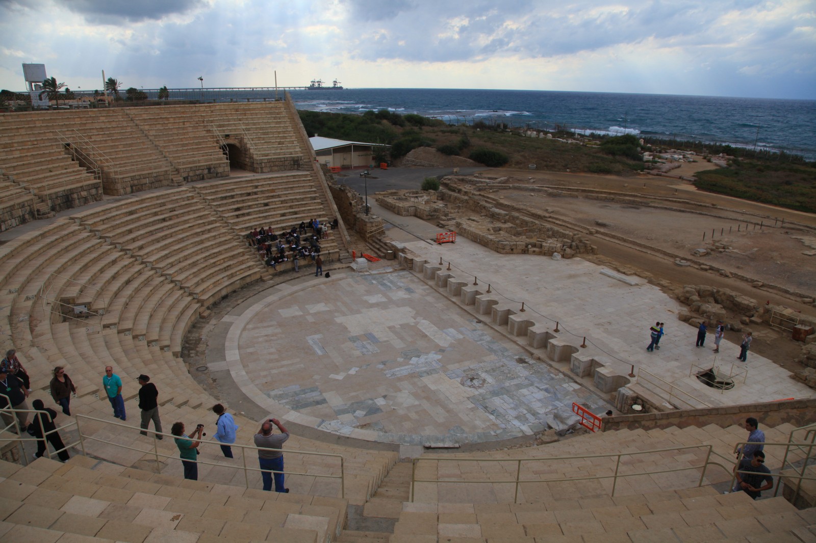 Which Roman city could survive without an amphitheatre?