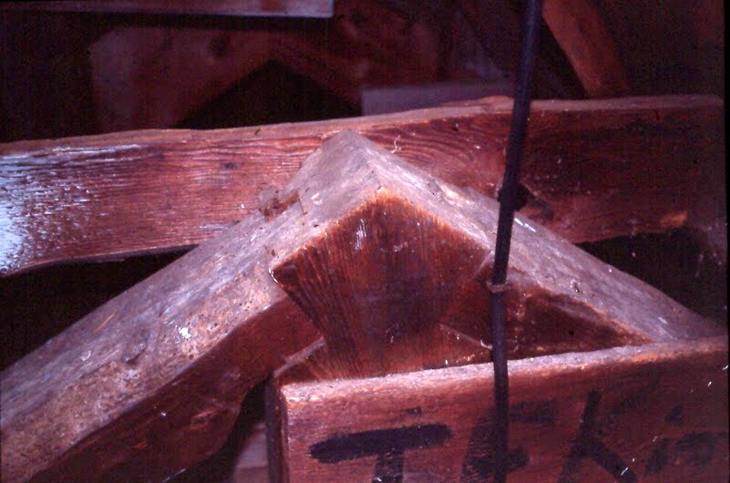 Detail of joinery in a king post truss.