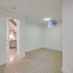 Bedroom in the basement with polished concrete flooring