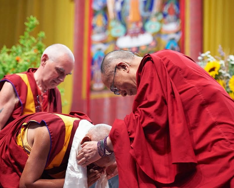 Lama Zopa Rinpoche receiving a khata from His Holiness the Dalai Lama, Livorno, Italy, June 15, 2014. Photo by Olivier Adam.