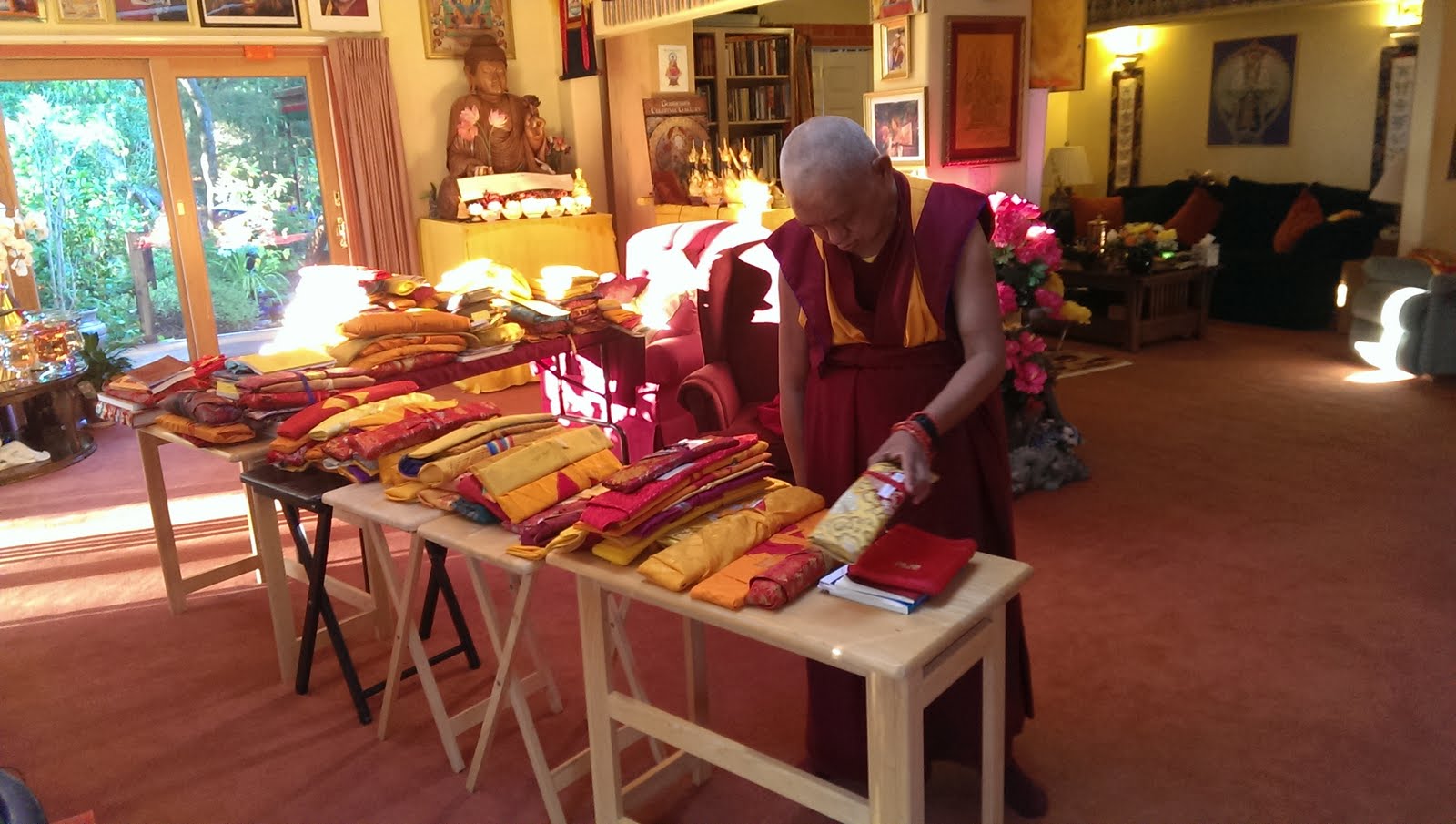 Rinpoche sorting through his texts. Ven. Roger Kunsang explains, "All of these we carry in four big heavy suitcases everywhere we go!" Sep 13,  2013 Photo: Ven. Roger Kunsang