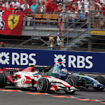 Anthony Davidson (GBR) Super Aguri F1 SA07 battles with Jenson Button (GBR) Honda RA107