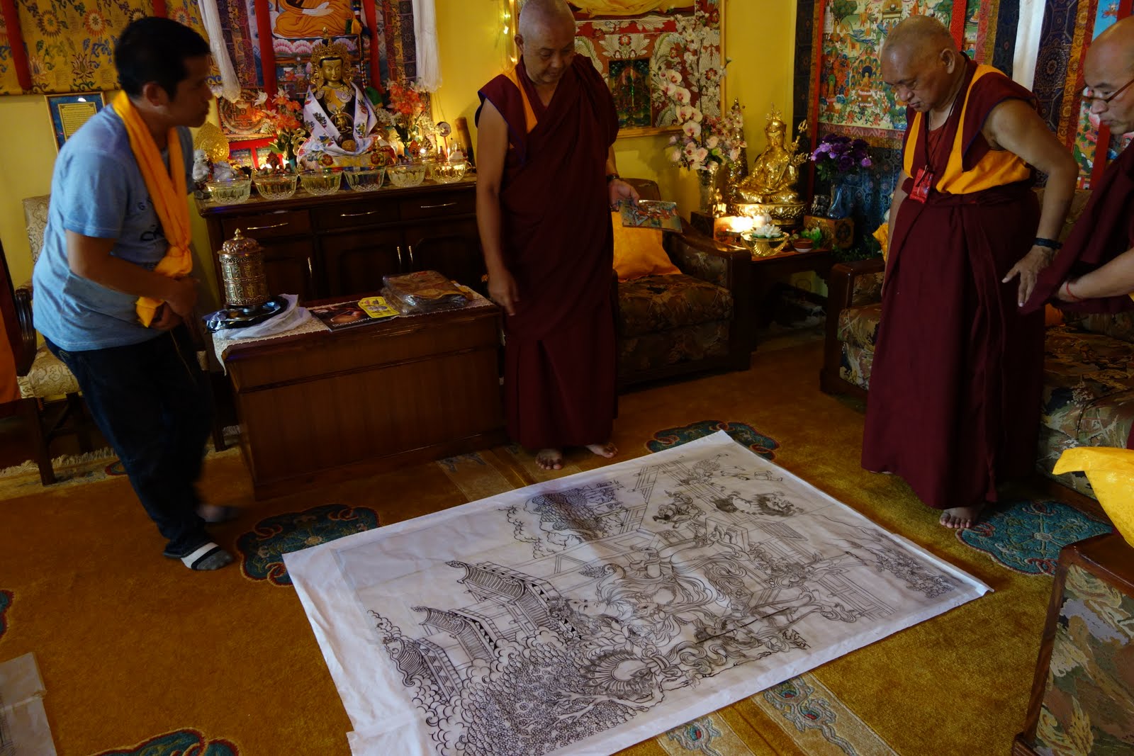 Rinpoche checking the art of thangkas he is having done: The Eight Fearless Taras and The Twenty-one Taras. Kopan Monastery, August 10, 2013 Photo: Ven. Roger Kunsang.