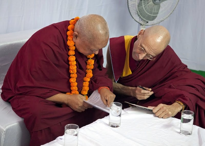 Lama Zopa Rinpoche with Ven. Kabir Saxena preparing remarks for Maitreya Project Foundation Stone Laying Ceremony, Kushinagar, India, December 13, 2013. Photo by Andy Melnic.