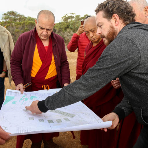 Lama Zopa Rinpoche discussing plans for a group retreat facility with Dale, the architect and Ven. Dondrub, De-Tong Ling Retreat Centre, Kangaroo Island, Australia, May 2015. Photo by Ven. Thubten Kunsang.