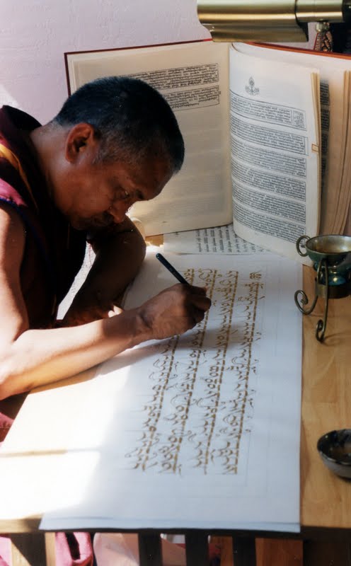 Lama Zopa Rinpoche writing the Prajnaparamita in gold