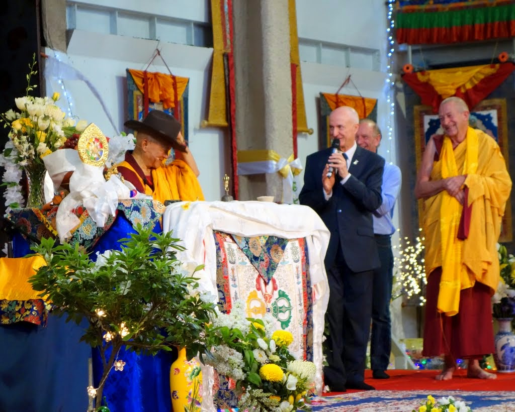 Ian Green, director of Great Stupa of Universal Compassion, offering Lama Zopa Rinpoche an iconic Akubra hat during the long life puja, Australia, October 23, 2014. Photo by Ven. Roger Kunsang.